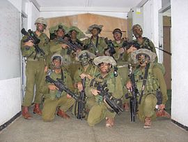 Le  Bataillon d'exécution du martyr Asaad est une milice des colonies en uniforme militaire officiel